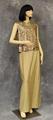 Evening dress ensemble of metallic gold knit jersey with sequin embellished top