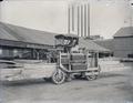 Machine transporting sawn timbers through a lumber yard