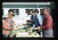 Crew husking corn at Vegetable Farm, Oregon State University, Corvallis, Oregon, 1975