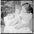 Home Economics student with a "practice baby," December 15, 1956