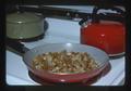 Fried potatoes in pan on stove, 1975