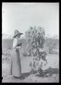Irene Finley standing beside cholla cactus