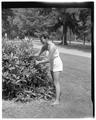 Promotional photo of an OSC co-ed pruning a bush