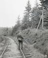 Herman Bohlman walking down railroad tracks