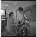 Home Economics students examining chair textiles, February 1964