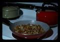 Fried potatoes in pan on stove, 1975