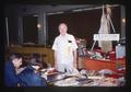 Bob Henderson with bourse table at coin show, Oregon, 1977