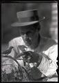 William L. Finley holding desert sparrows