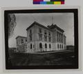 Portland Customs House, with two men on sidewalk at entrance. (recto)