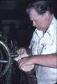Mr. Thomas Palmer stitching shoes, close up from left side