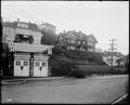 Group of large houses on Westover St., Portland. Two-car garage built into hillside in foreground.