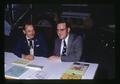 Peter Lyngstrand and Ted Witlich staffing a booth at Pacific International Livestock Expo, Oregon, November 1973