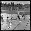 Students playing volleyball on the rooft of Snell Hall