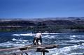 Man fishing on platform above Celilo Falls on the Columbia River