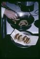 Seafoods Laboratory director Dr. David Crawford cooking fish sausage, circa 1966