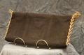 Clutch of brown woven cord blocked in 3 rectangles at front and back