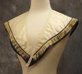 Collar of ivory satin trimmed in a band of navy satin with cream fringe