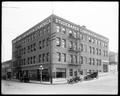 Studebaker showroom, 10th and Glisan, Portland. Three autos parked outside building.