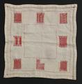 Textile Sampler of natural woven linen with eight intricately patterned rectangles encircling the square textile