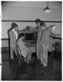 Aero club looks at model wind tunnel, Milosh Popovich assisting, October 1953