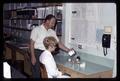 Technician with Allen Anglemier and fishmeal concentrate, Oregon State University, Corvallis, Oregon, circa 1969