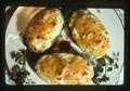 Closeup of twice baked potatoes on plate, 1975