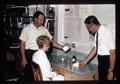 Technician with Allen Anglemier, Harold Schultz, and fishmeal concentrate, Oregon State University, Corvallis, Oregon, circa 1969