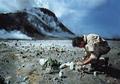 Dr. John Baross, a researcher at Oregon State University, taking samples to study from an area near the Mount St. Helens eruption site