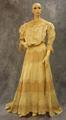 Dress of pale yellow taffeta and tan lace