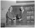 Albert Arust of Portland presents 43 volumes of The Lumberman to Forestry Dean Walter McCulloch, Fall 1961