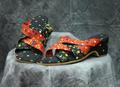 Sandals of black and red fabric with dainty, multi-colored floral print