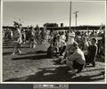 Men Kneeling, from Indian Photographing Tourist Photographing Indian series, Crow Fair, Crow Agency, Montana (recto)