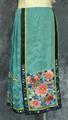 Skirt of aqua green silk crepe damask with embroidered butterflies and flowers in satin stitch and Peking knot stitch