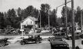 Automobiles at railroad crossing near the Millrace