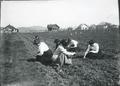 Women students gardening on campus (Class scene)