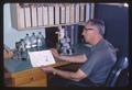 Dr. Paul Ritcher sitting at desk, circa 1965