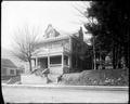 William MacMaster home, Sellwood area, Portland. Old brick building on hill, street in foreground.