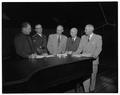 OSC faculty and administrators gathered around a piano in the Coliseum, October 26, 1954