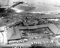 Above view of Hatfield Marine Science Center with cars parked and jetty with boat