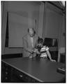 Zoology professor Ivan Pratt with a boy, May 23, 1952