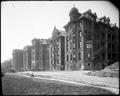 St. Vincent's Hospital, Portland. Autos parked on 25th St. in foreground.