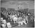 Bill Langan talking to high school students, trying to make the next year "bigger and better than ever before it!", February 1953