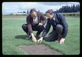 Bill McGuire and Rod Frakes examining turf plots, Corvallis, Oregon, circa 1965