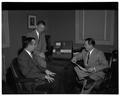 Three unidentified men posing with Crown Zellerbach promotional materials