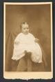 Photograph of baby/toddler in christening gown.