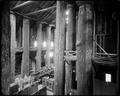 Interior of Forestry Building, on Lewis & Clark Exposition site, from balcony overlooking display cases on ground floor.