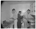 Students washing dishes in the new men's residence co-op, September 1954