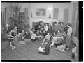 Janet Brande, sophomore in Lower Division, presents her large chorus of Snell Hall girls in a Christmas concert in dormitory, December 1950