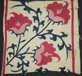 Textile panel of natural linen embroidered with heavy silk thread in a vined flower large design