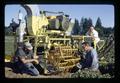 Wilson Foote, Dean Booster, and another with strawberry harvester on Bob Winn farm, near Weston, Oregon, circa 1970